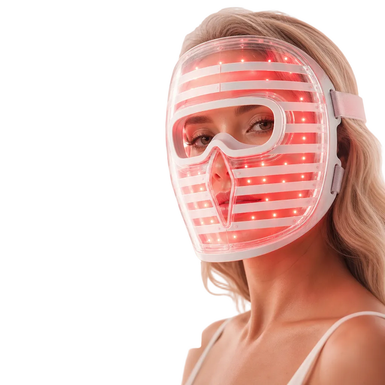 Woman using advanced full-face LED light therapy mask for skincare support
