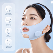 Woman using V-line facial lifting device during contour care routine