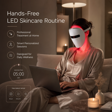 Woman using a hands-free LED face mask during a relaxing at-home skincare session