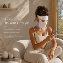 Woman holding LED face mask designed for quick 10-minute skincare sessions
